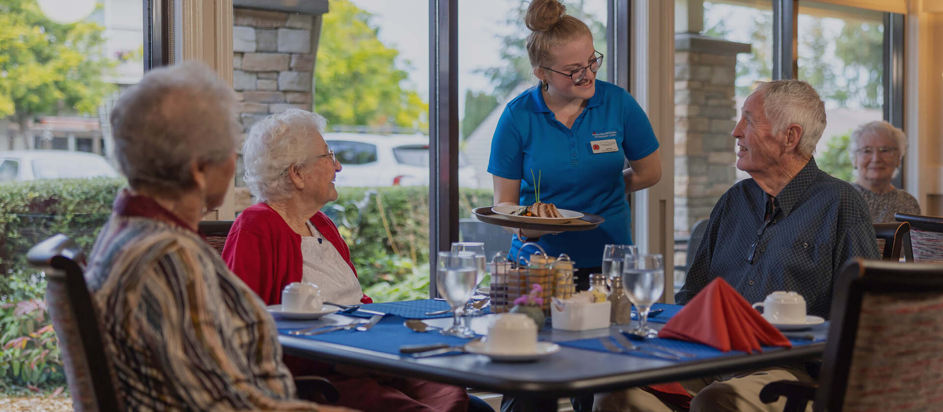 seniors in happy dining room